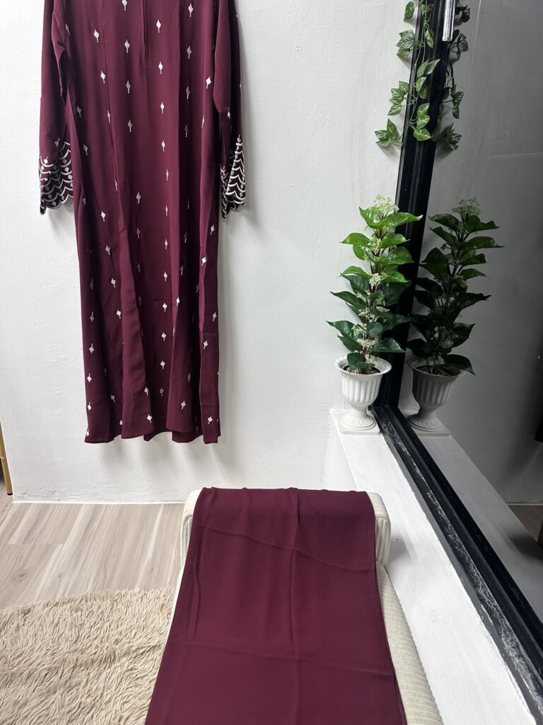 The SG60 Maroon Red & White Embroidery Abaya
Now just $60 (usual $120)
A Shade That Speaks
Deep maroon red, inspired by Singapore’s flag at sunrise—bold, elegant, and carrying the promise of new beginnings.
Embroidery That Whispers
Hand-stitched white motifs along the flowing cuffs and skirt echo the Merlion’s playful crest. It’s detail you’ll lean in to admire, time after time.
Comfort Without Compromise
Our stretch crepe gives you all-day breathability under the Singapore sun, with a gentle drape that moves when you move—no stiffness, no cling, just pure grace.
Effortless Wear
A hidden front zip and side pockets mean “chic” meets “practical.” Slip it on in seconds, tuck in your phone, and you’re ready for everything from parade grounds to rooftop soirees.